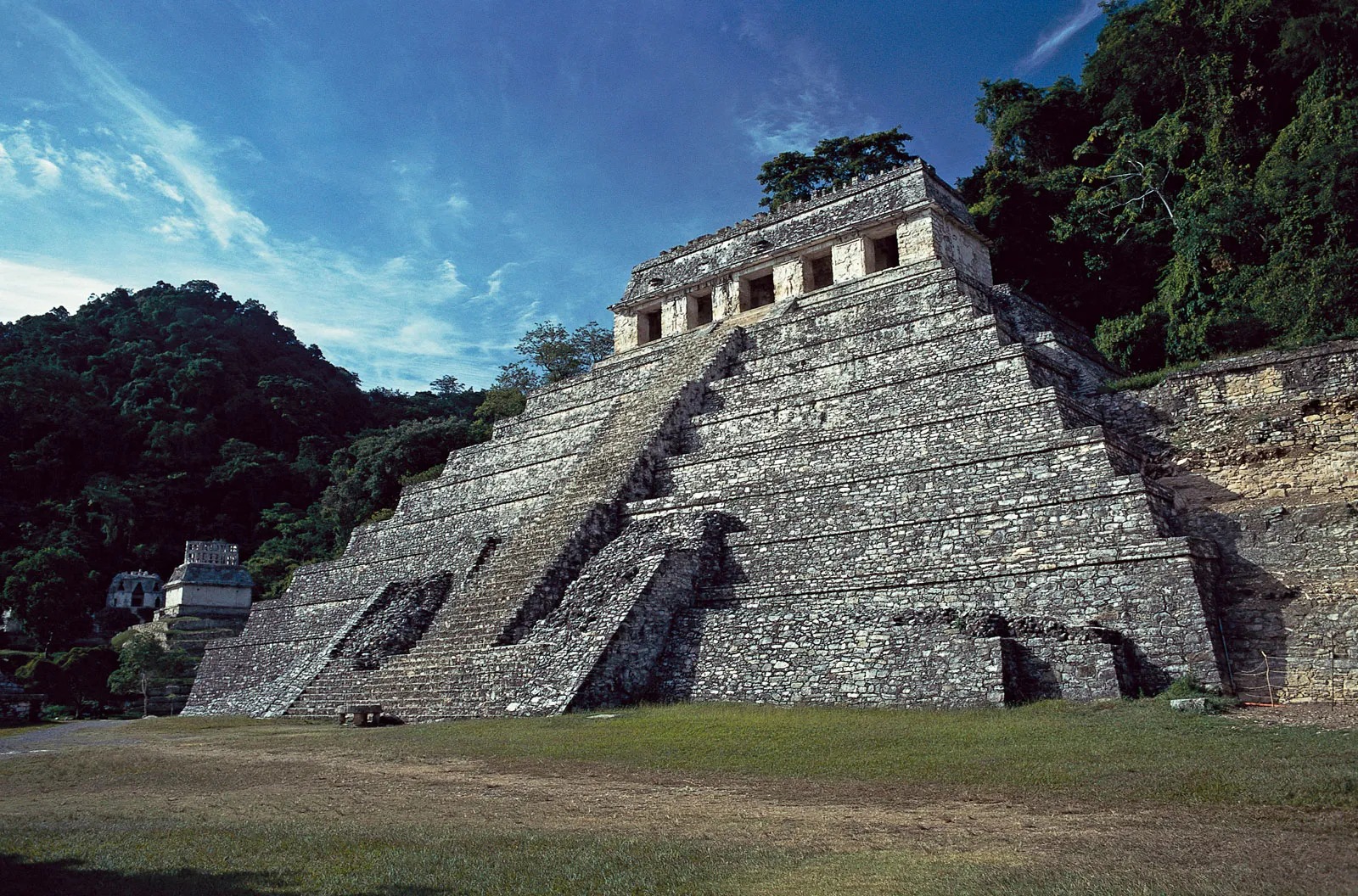 Ancient stone stepped pyramid with a small temple at the summit, set in lush jungle.](https://example.com) or just the text
