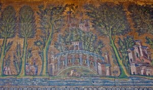 Colorful mosaic of a curved arched bridge over a river, with medieval towers and tall trees on either side under a gold sky.