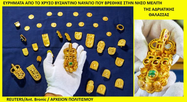 Gold Byzantine treasure laid out on blue cloth; a gloved hand holds a large ornate pendant among coins and small pieces.