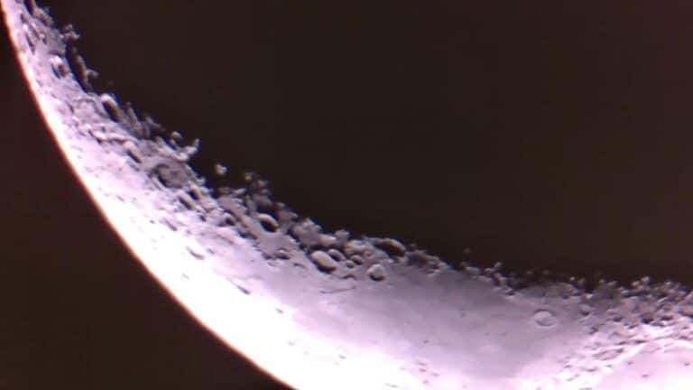 Close-up of the Moon's cratered limb along the terminator, illuminated by sunlight at the edge of a crescent.