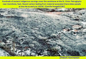 Close-up of weathered sandstone etched with Indigenous petroglyphs near St. Victor, Saskatchewan; top caption mentions dating to 120 BC.
