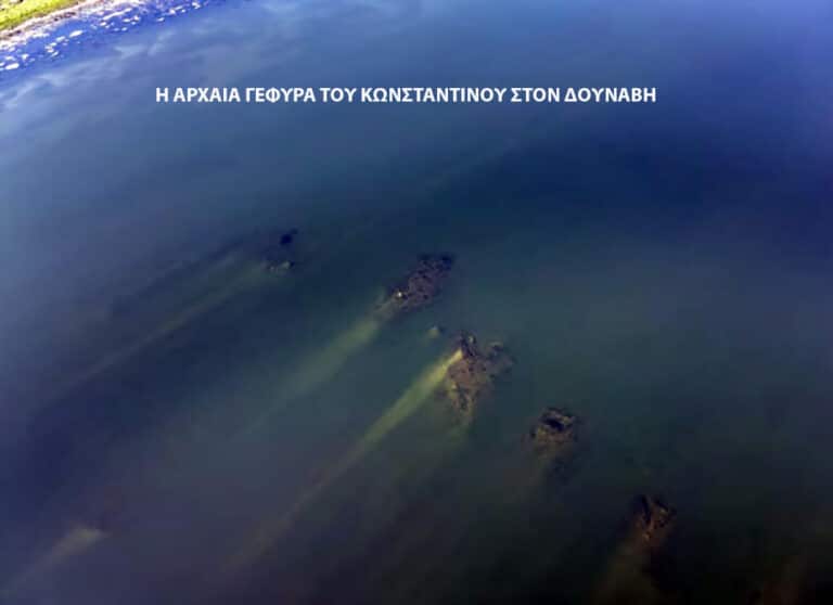 Aerial view of the Danube River showing the sunken pillars of Constantine's ancient bridge in the water.