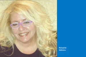 Portrait of a smiling blonde woman wearing purple glasses, with a blue sidebar displaying the name Κατερίνα Κάλτσου.