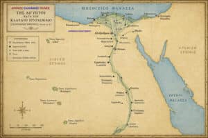 Map of ancient Greek cities in Egypt during Claudius Ptolemy's era, showing the Nile delta coast with labeled Greek towns and landmarks along the Mediterranean and Erythraean Sea colorized in sepia tones.